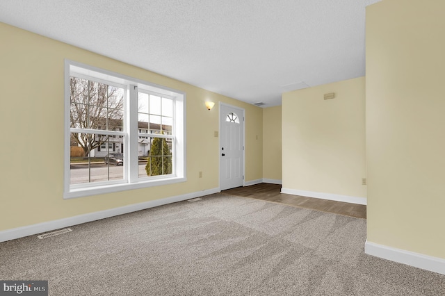 interior space featuring a textured ceiling