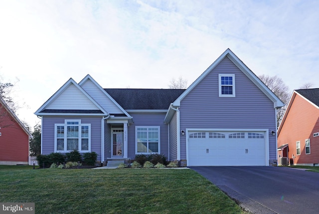 view of front facade with cooling unit, a front lawn, and a garage