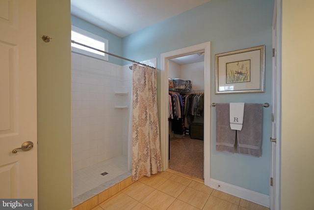 bathroom with tile patterned flooring and a shower with shower curtain