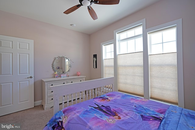 bedroom with light carpet and ceiling fan