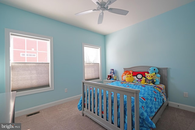 carpeted bedroom with ceiling fan