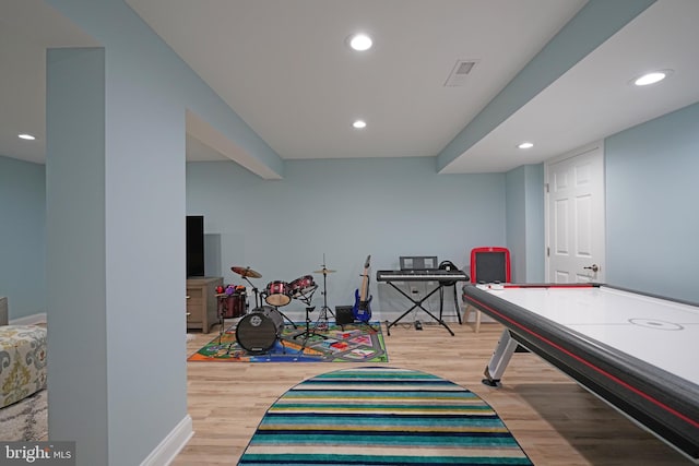 recreation room featuring light wood-type flooring