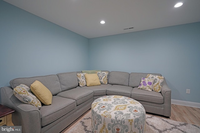 living room with light hardwood / wood-style flooring