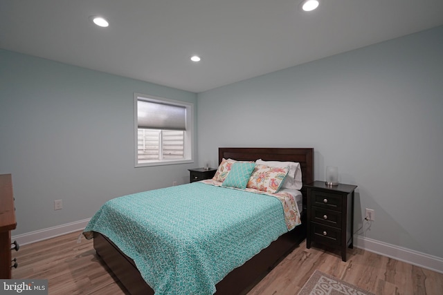 bedroom with light wood-type flooring