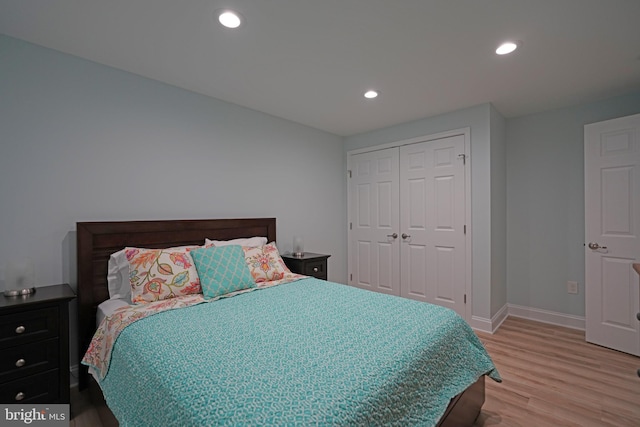 bedroom featuring a closet and light hardwood / wood-style floors