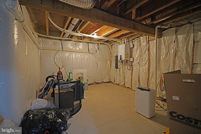 basement featuring tankless water heater