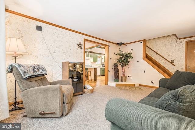 carpeted living room with ornamental molding