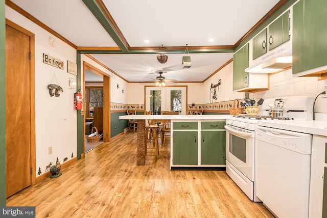 kitchen with ceiling fan, green cabinets, crown molding, white appliances, and light wood-type flooring