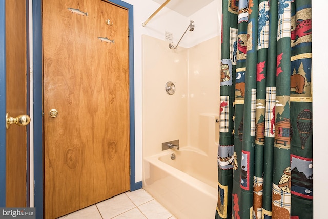 bathroom with tile patterned flooring and shower / bath combo with shower curtain