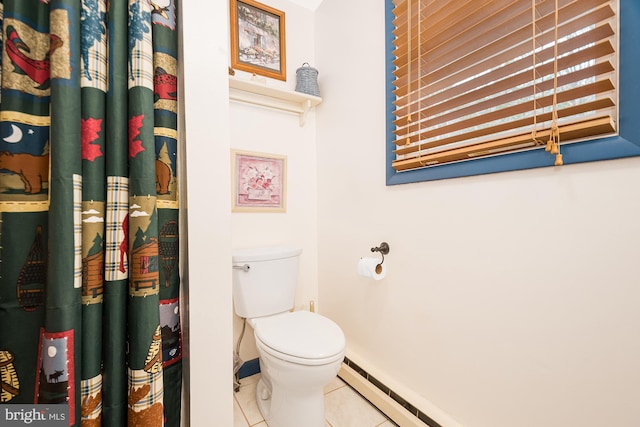 bathroom with toilet and tile patterned floors