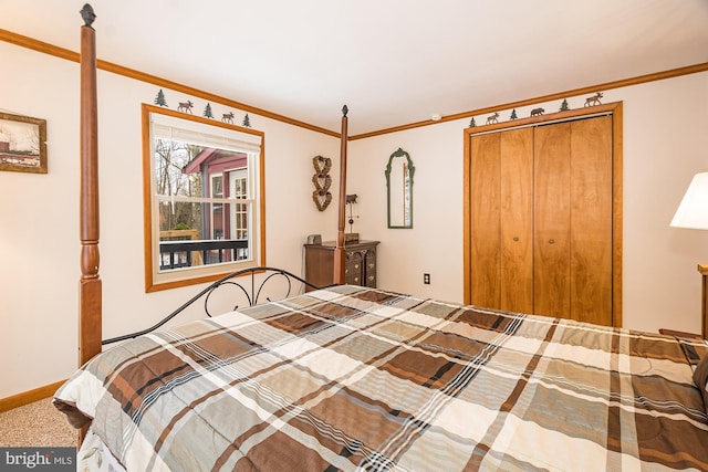 carpeted bedroom featuring crown molding and a closet