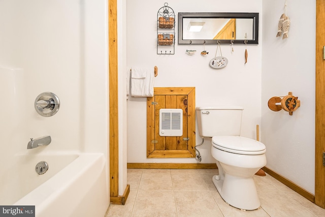 bathroom featuring tile patterned flooring, bathing tub / shower combination, heating unit, and toilet