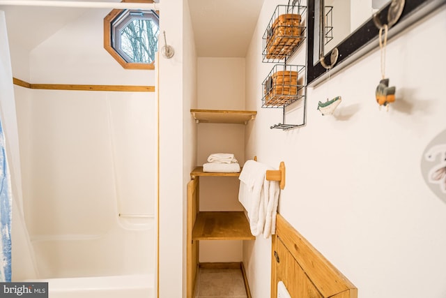 bathroom featuring a shower with shower curtain and tile patterned floors