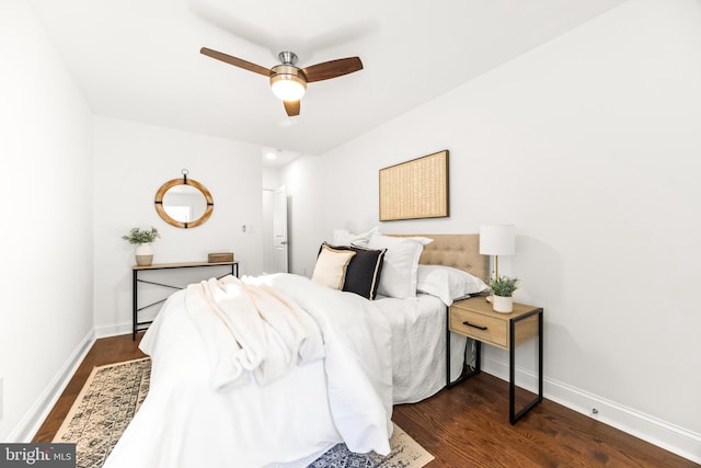 bedroom featuring ceiling fan and dark hardwood / wood-style floors