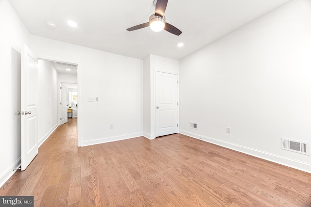 unfurnished bedroom with ceiling fan and light wood-type flooring