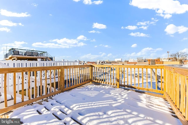 view of snow covered deck