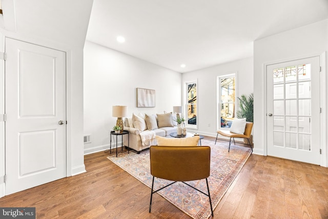 living room with light hardwood / wood-style flooring