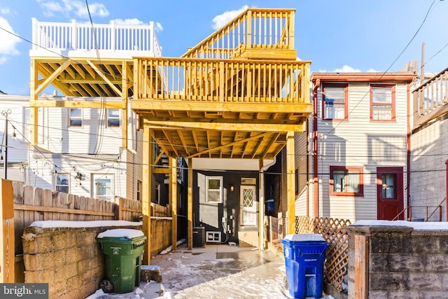 back of house with a wooden deck