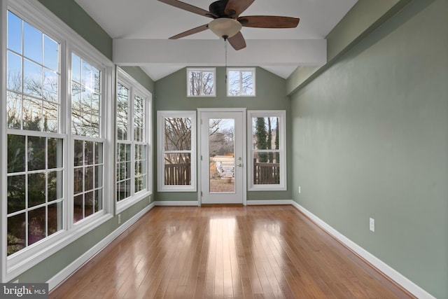 unfurnished sunroom featuring lofted ceiling and ceiling fan