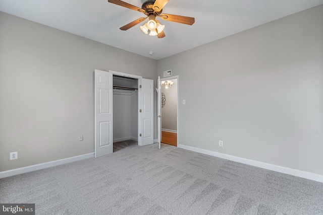 unfurnished bedroom featuring a ceiling fan, carpet, visible vents, and baseboards