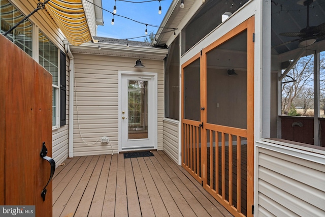 wooden deck featuring a sunroom