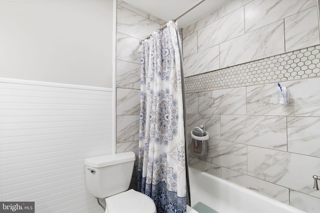 bathroom with toilet and shower / tub combo