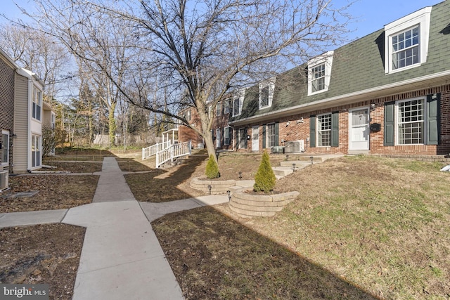 exterior space featuring a front lawn