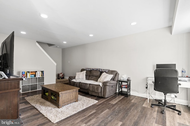 living room with dark hardwood / wood-style flooring