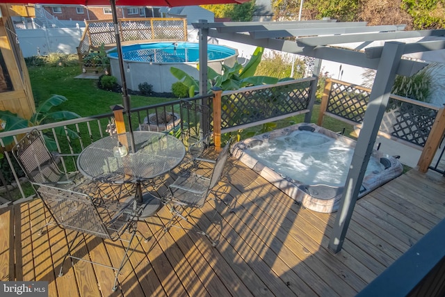 deck with a pergola and a yard