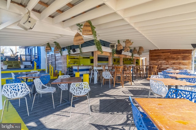 wooden deck featuring an outdoor bar