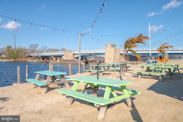 view of community featuring a boat dock and a water view