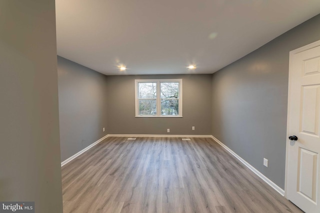 unfurnished room featuring light wood-type flooring