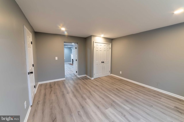 spare room with light hardwood / wood-style flooring