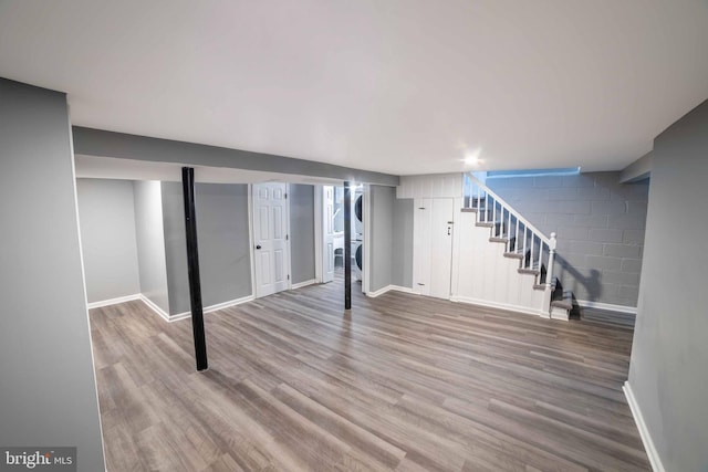 basement with hardwood / wood-style floors