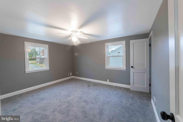 interior space featuring carpet flooring and ceiling fan