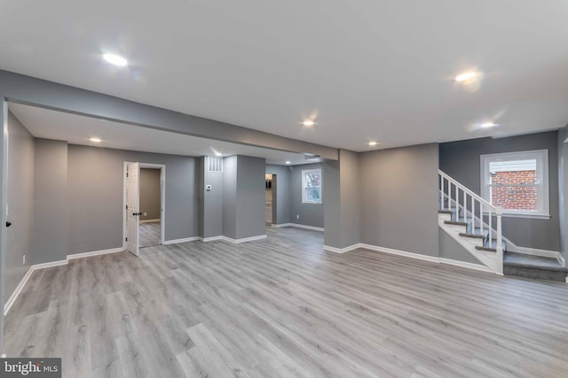 basement featuring light hardwood / wood-style floors