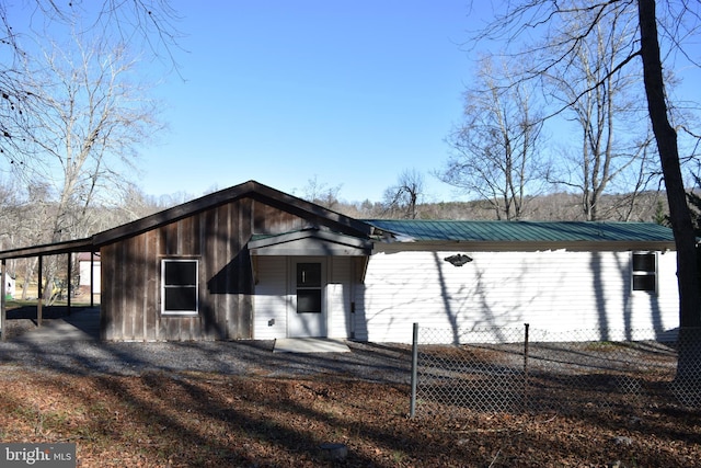 exterior space with a carport