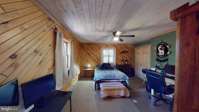 bedroom with ceiling fan, wooden walls, and wood ceiling