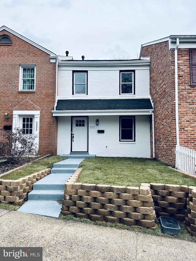 view of front of property with a front lawn