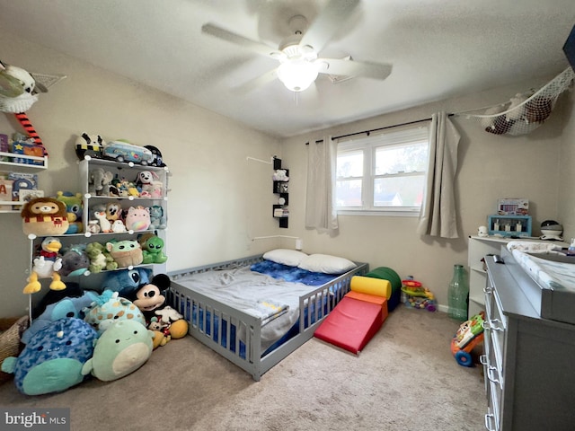 carpeted bedroom with ceiling fan