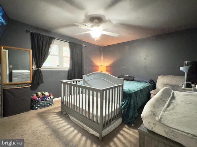 carpeted bedroom featuring ceiling fan and lofted ceiling