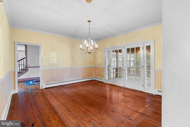 unfurnished dining area featuring ornamental molding, dark hardwood / wood-style flooring, a chandelier, and a baseboard heating unit