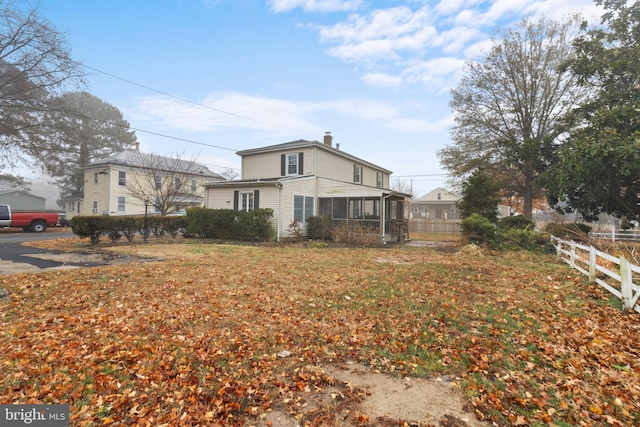 view of yard featuring a sunroom