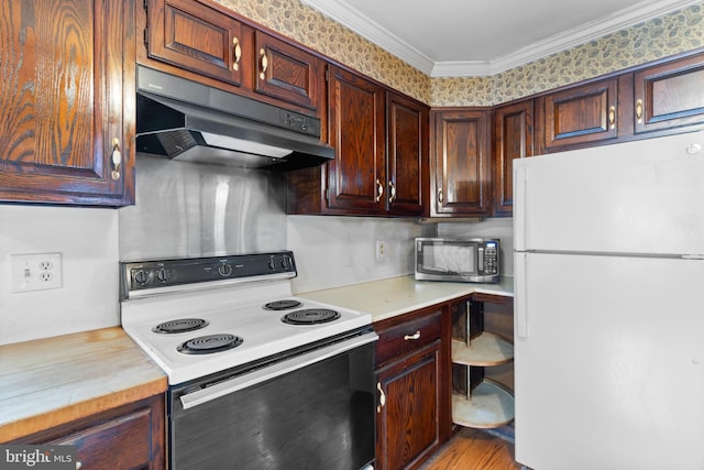 kitchen featuring dark brown cabinetry, light hardwood / wood-style floors, white appliances, and ornamental molding