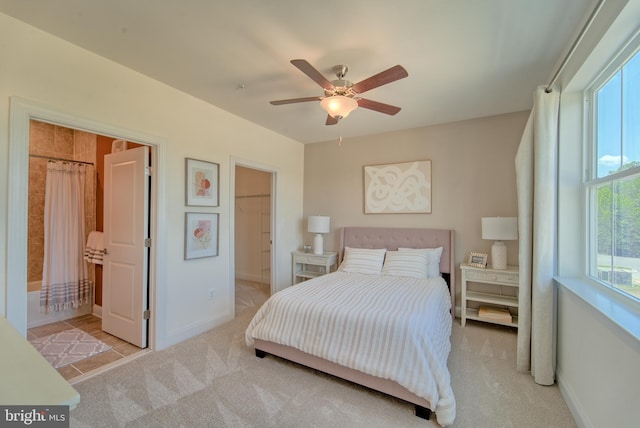 bedroom with light carpet and ceiling fan