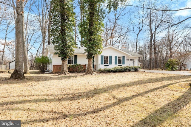 ranch-style home with brick siding and an attached garage