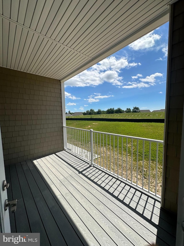 wooden terrace with a rural view