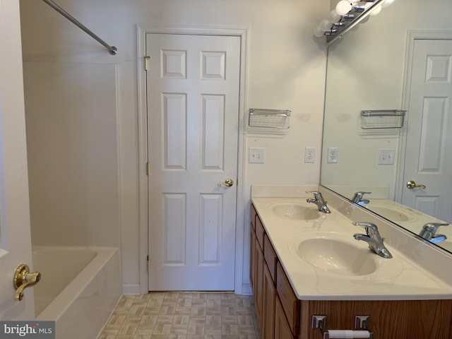 bathroom featuring shower / bathing tub combination and vanity