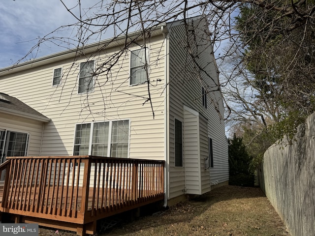 back of property featuring a deck