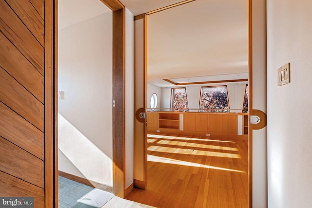 corridor featuring light hardwood / wood-style floors